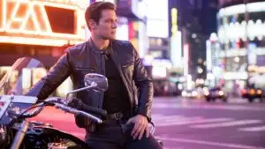 Man Waiting Beside Motorcycle at Night Lights