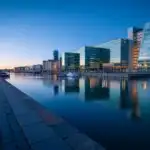 Modern Glass Waterfront City at Dusk