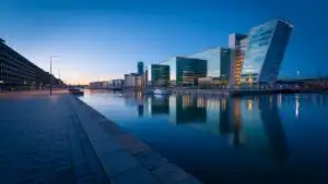Modern Glass Waterfront City at Dusk