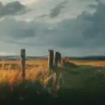 Quiet Field Under Heavy Clouds