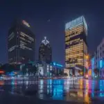 Rainy Night City Street with Neon Reflections