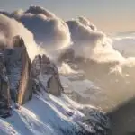 Rolling Clouds Over Snowy Cliffs