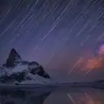 Star Trails Over Mountain Lake at Night