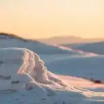 Sunset Light Hitting Snowy Hills