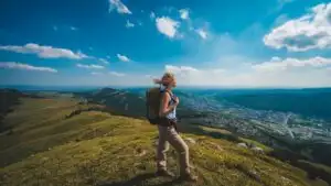 Traveler Resting on Hilltop with View