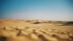 Vast Desert Under Clear Blue Sky