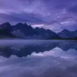 Water Reflections Under Purple Sky