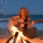 Shakira Singing Beside a Bonfire on the Beach