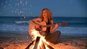 Shakira Singing Beside a Bonfire on the Beach