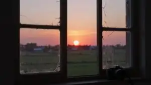 Sunset Light Through Broken Window