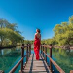 Woman Standing on Wooden Bridge Over River