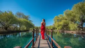 Woman Standing on Wooden Bridge Over River