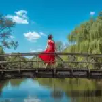 Woman Walking Across Wooden Bridge in Natural Setting