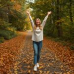 Woman Standing on Path Covered with Leaves