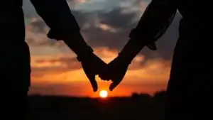 Couples Holding Hands Sunset Photo