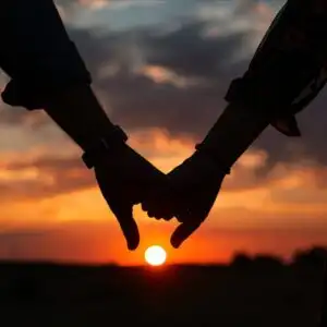 Couples Holding Hands Sunset Photo