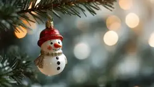 Vintage Snowman Ornament Hanging on Fir Branch