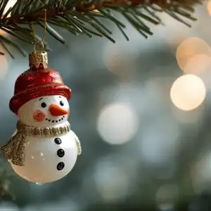 Vintage Snowman Ornament Hanging on Fir Branch