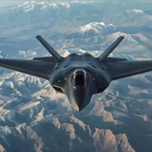 A Stealth Bomber Flying Low Over a Mountain Range