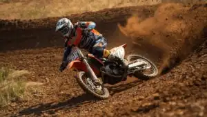 Dirt Bike Rider Skidding Around a Tight Corner