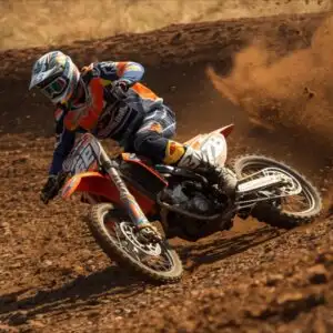 Dirt Bike Rider Skidding Around a Tight Corner