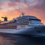 Massive Cruise Ship Leaving Port at Sunset