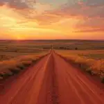 Red Dirt Road Through Prairies Sunset