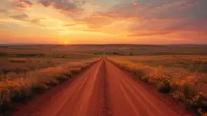 Red Dirt Road Through Prairies Sunset