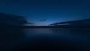 Still Water Under Dark Sky