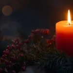 Advent Candle Flickering in Evening