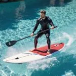 Chris Hemsworth Paddleboarding in Crystal Water