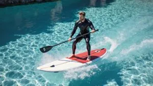 Chris Hemsworth Paddleboarding in Crystal Water