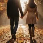 Couple Holding Hands Walking Path Autumn Leaves