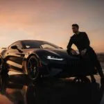 Cristiano Ronaldo Leaning on a Sports Car at Dusk