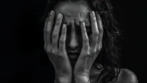 Crying Woman Hands Over Face Black and White