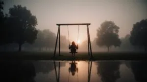 Empty Swing Set in Misty Sunset Park