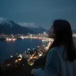 Girl Watching City Lights from Rooftop
