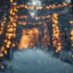 Golden Bokeh Lights Reflecting on a Snowy Window