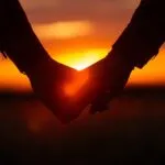 Hands Intertwined at Sunset