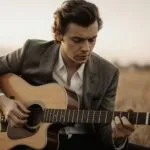 Harry Styles Strumming Guitar Outside