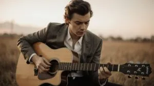 Harry Styles Strumming Guitar Outside
