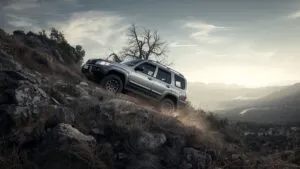 Off-Road SUV Climbing a Rocky Mountain Trail