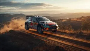 Rally Car Jumping Over Dirt Hill