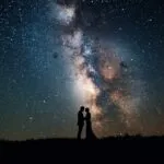 Romantic Couple Silhouette Against Milky Way