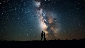 Romantic Couple Silhouette Against Milky Way