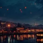 Sky Lanterns Over Ancient Harbor