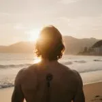 Surfer Waiting for Waves at Sunset