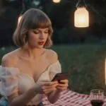 Taylor Swift having a picnic under lanterns