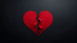 Torn Red Paper Heart Dark Table