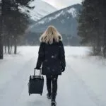 Traveler Walking Through Snowy Path